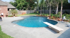 gunite-lagoon-pool-with-diving-board-tanning-ledge-benches-diamond-brite-french-gray-plaster